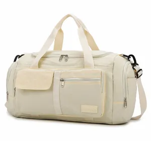 Large capacity travel duffel bag in beige with detachable strap for gym and sports