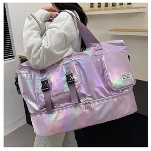 Detail of holographic purple travel bag showing bottom shoe compartment and logo