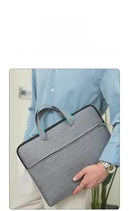 Close-up of durable oxford fabric briefcase with reinforced handle and blue stitching detail