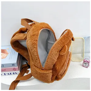 Detailed view of the brown plush backpack featuring soft texture and spacious interior lining