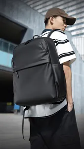 Close-up of lightweight matte black waterproof laptop backpack with sleek side pockets
