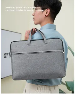 Modern grey laptop bag carried by a man, professional Oxford fabric business briefcase