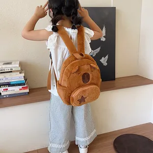 Brown plush bear backpack for children with cute embroidery and soft texture