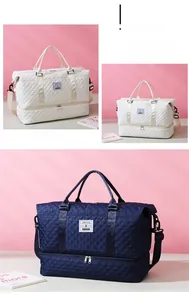 Quilted travel duffel with bottom shoe compartment and wet-dry separation feature