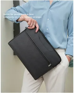 Detail of dark grey waterproof laptop bag with front zipper pocket and sleek business style