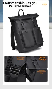 Close-up of black matte roll-top backpack showing metal buckles and reinforced stitching
