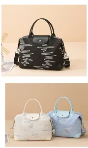 Detailed close-up of embossed texture fabric and colorful wave embroidery on travel bag