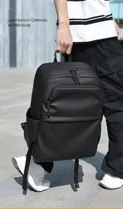 Waterproof matte black laptop backpack showing side pockets and hidden front zipper
