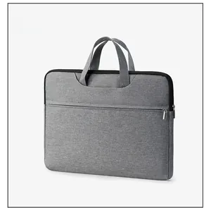 Side view detail of a light grey oxford fabric laptop bag with premium metal zippers