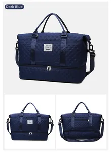 Detail of quilted dark blue gym bag showing large capacity and dedicated shoe compartment