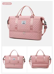 Detail view of light pink quilted travel bag with separate shoe compartment and shoulder strap