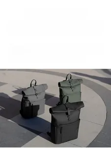 Three outdoor roll-top waterproof backpacks in grey, green, and black with buckle straps