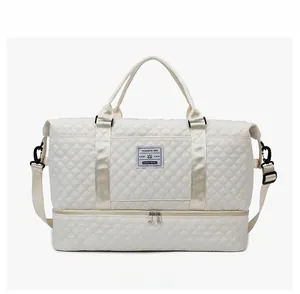 Detail view of large travel bag with quilted pattern and separate shoe compartment