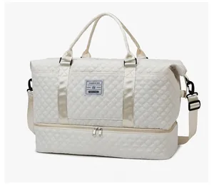 Quilted off-white travel bag featuring a bottom shoe compartment and side view detail