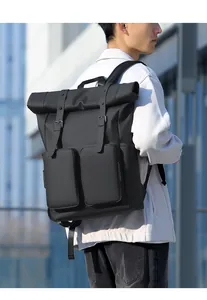Detail of waterproof roll-top backpack featuring dual zip pockets and adjustable buckle straps