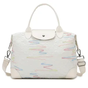 Large capacity quilted travel tote with colorful embroidery and detachable shoulder strap