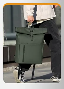 Detail of waterproof dark green roll-top backpack with vertical front zipper pocket