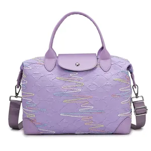 Large purple travel bag with wave embroidery and adjustable shoulder strap for fitness