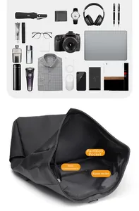 Detailed interior of black waterproof backpack showing multi-layer laptop storage compartments
