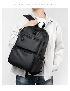 Detail of waterproof matte black laptop backpack showing large capacity and reinforced handle