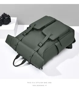 Detail of dark green waterproof backpack with dual zipper pockets and matte finish