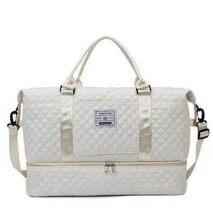 Cream quilted fitness bag with independent shoe compartment and detachable strap