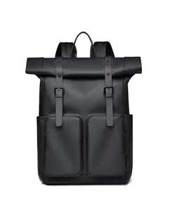 Detail of matte black roll-top backpack with dual zippered pockets and buckle straps