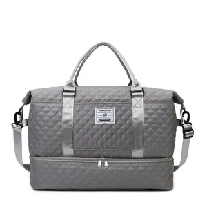 Quilted travel bag in grey with shoe compartment and dry-wet separation for gym fitness