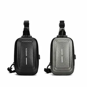 Detail of hard shell chest bag in black and grey colors with USB charging port