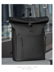 Detail of roll-top backpack with metal buckle and matte waterproof fabric for commuters