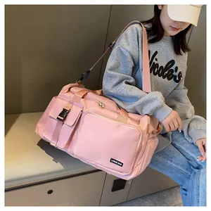 Bolsa de deporte rosa de gran capacidad con correa ajustable y bolsillo lateral