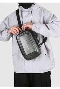 Detail of hardshell chest bag featuring carbon fiber texture and secure combination lock