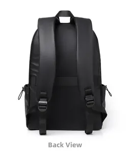 Detail view of the black backpack's padded S-shape straps and luggage trolley strap