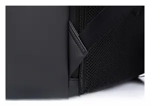 Macro detail of reinforced shoulder strap stitching on black waterproof laptop backpack