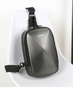 Detail of hard shell chest bag featuring carbon fiber texture and secure combination lock