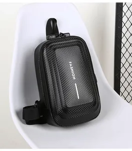 Detail of black hard shell chest bag with carbon fiber texture and secure combination lock