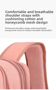 Detail of pink backpack thick shoulder straps with breathable honeycomb mesh padding