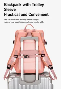 Pink travel backpack detail featuring a convenient trolley sleeve for luggage attachment