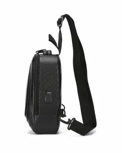 Detailed side view of black hard shell sling bag with USB port and security lock