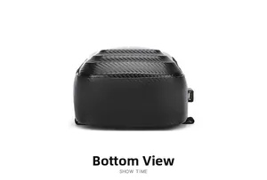Detailed bottom view of black chest bag showing carbon fiber texture and USB port