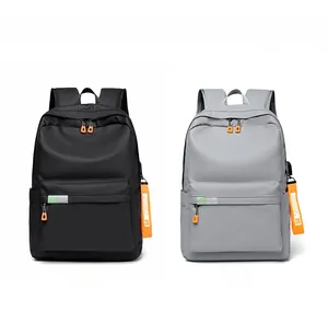 Front view of black and gray fashion backpacks with orange zippers and strap details