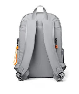 Rear view of grey large-capacity backpack with padded shoulder straps and orange accents