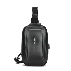Men's black hardshell chest bag with carbon fiber texture, anti-theft lock, and USB port