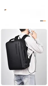 Close-up of black travel backpack showing integrated external USB charging port feature