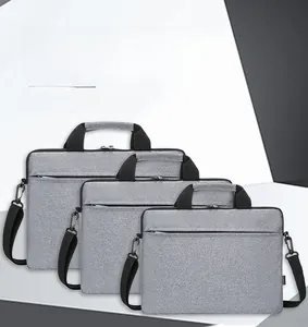 Three sizes of light grey slim laptop bags with handles and detachable shoulder straps
