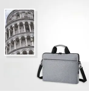 Slim grey laptop bag with adjustable shoulder strap and dual top handles detail