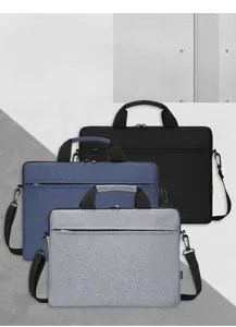 Slim laptop bags in black, blue, and grey with shoulder straps and front zipper pockets