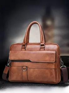 Detailed macro view of vintage brown leather texture and metal D-ring on briefcase