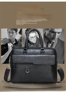 Detail of black leather briefcase featuring lychee texture and adjustable shoulder strap