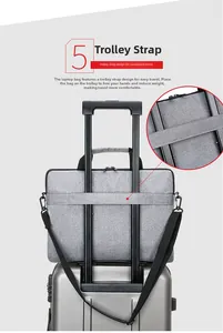 Slim laptop bag with back trolley strap for luggage, shown on a silver suitcase